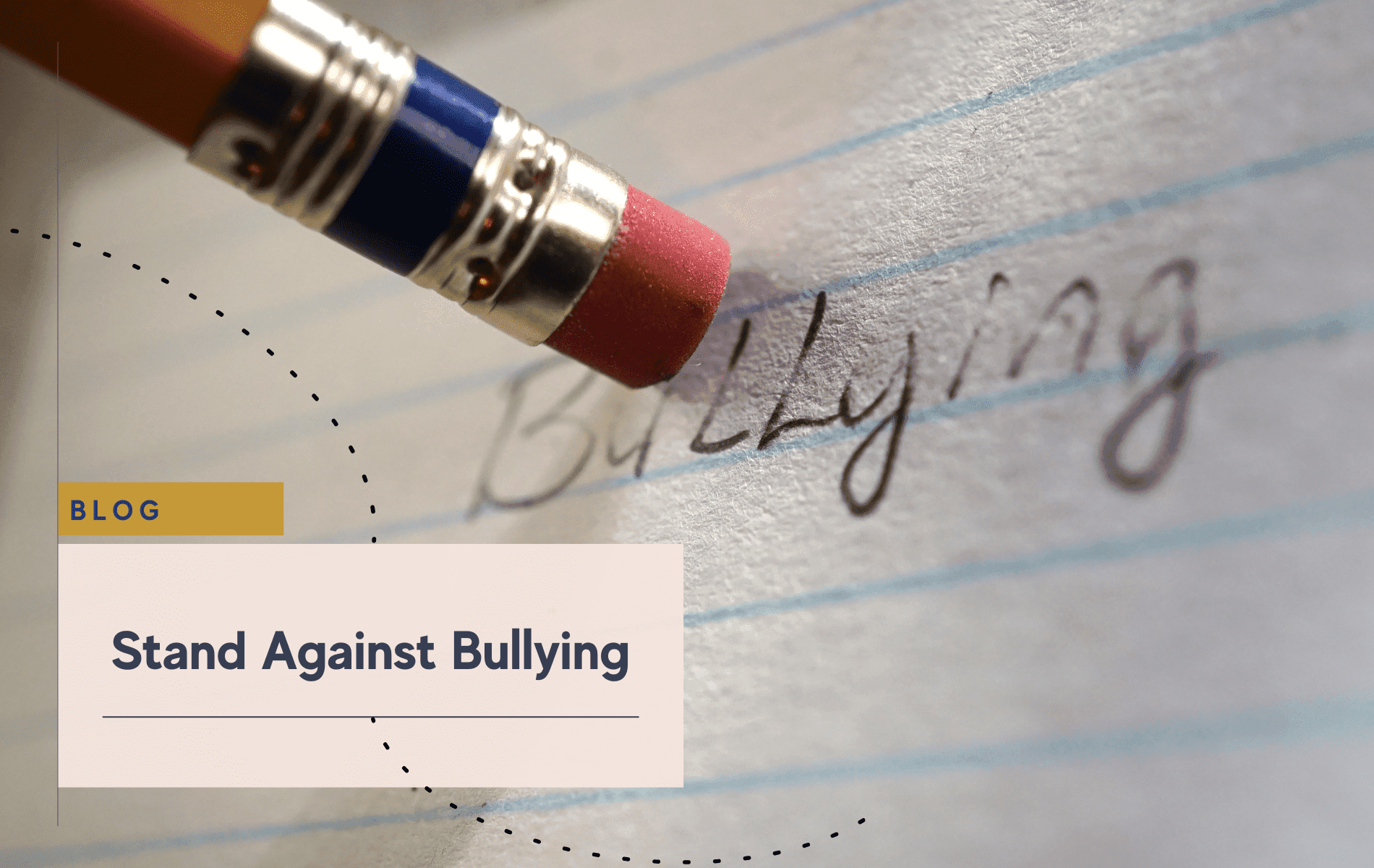 Pencil eraser removing the word "Bullying" from lined paper.